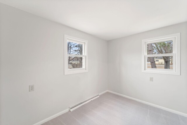 12005 Stacy Trl, Lindstrom, MN 55013 - unfurnished room featuring a baseboard radiator, carpet flooring, and baseboards