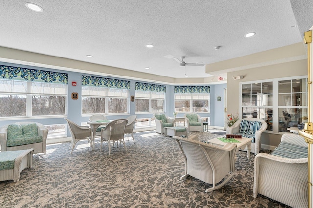 carpeted living room with a wealth of natural light, a textured ceiling, recessed lighting, and ceiling fan
