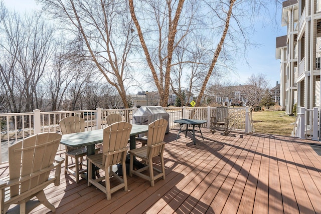 deck with outdoor dining area