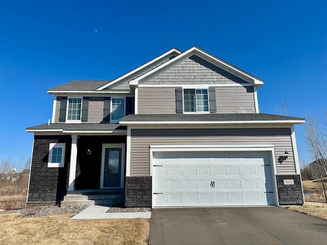 408 Tanner Dr, Waverly, MN 55390 - craftsman house with stone siding, aphalt driveway, and an attached garage