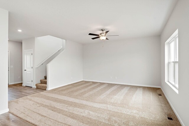 408 Tanner Dr, Waverly, MN 55390 - carpeted spare room with stairway, ceiling fan, and recessed lighting