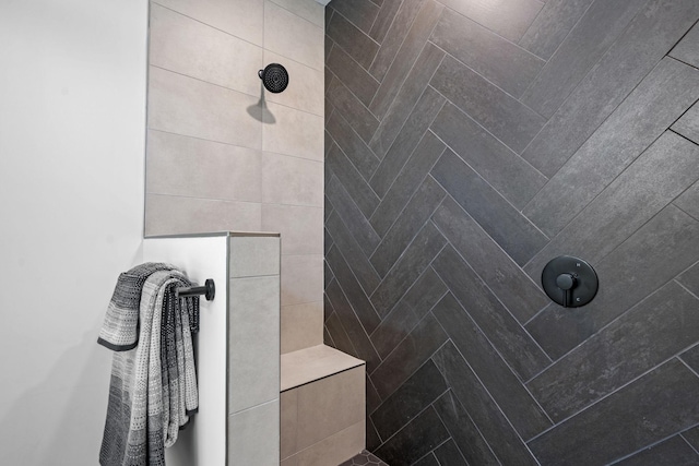 bathroom featuring a tile shower