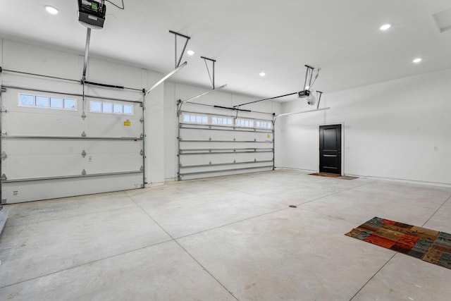 garage featuring a garage door opener and recessed lighting