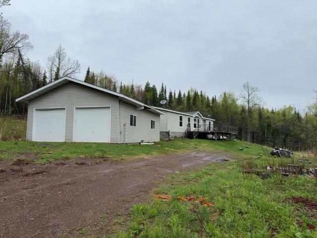 1335 Big Noise Pit Rd, Two Harbors, MN 55616 - view of side of home with a garage and a wooden deck