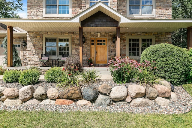 1301 Pondview Ln, Saint Joseph, MN 56374 - entrance to property with covered porch and stone siding