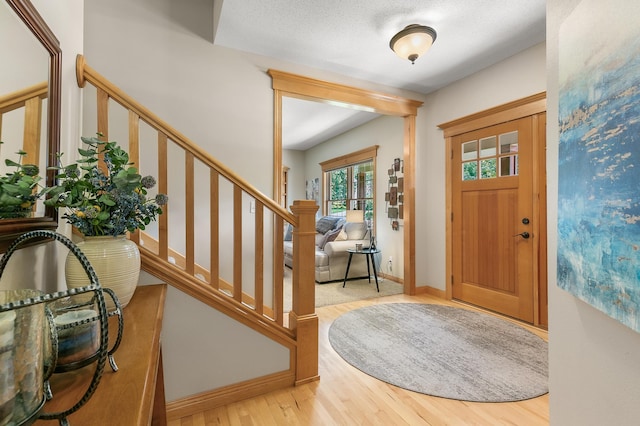 1301 Pondview Ln, Saint Joseph, MN 56374 - foyer with stairway, baseboards, and wood finished floors