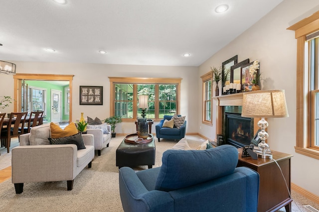 1301 Pondview Ln, Saint Joseph, MN 56374 - living area with recessed lighting, baseboards, and a glass covered fireplace