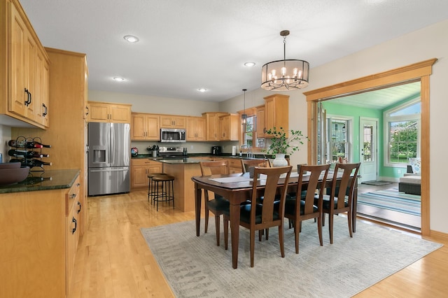 1301 Pondview Ln, Saint Joseph, MN 56374 - dining area with recessed lighting, baseboards, a notable chandelier, and light wood-style floors