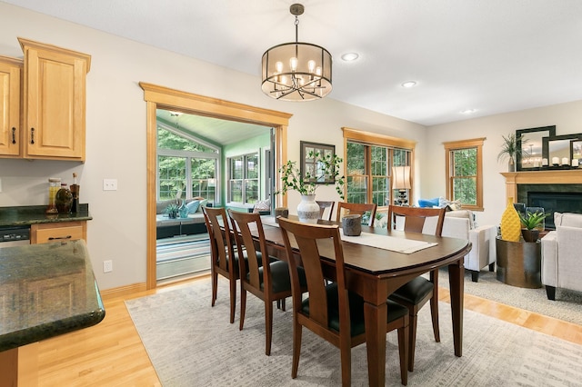 1301 Pondview Ln, Saint Joseph, MN 56374 - dining area with a fireplace, baseboards, recessed lighting, a chandelier, and light wood finished floors