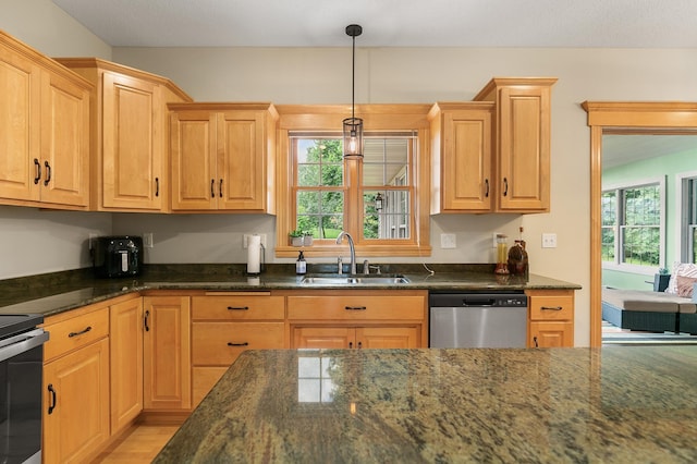 1301 Pondview Ln, Saint Joseph, MN 56374 - kitchen featuring a sink, light wood-style floors, dark stone countertops, stainless steel appliances, and pendant lighting