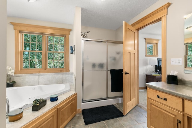 1301 Pondview Ln, Saint Joseph, MN 56374 - bathroom featuring vanity, a stall shower, tile patterned floors, and a garden tub