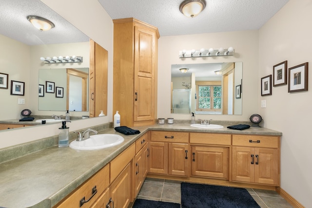 1301 Pondview Ln, Saint Joseph, MN 56374 - full bathroom with a textured ceiling, a sink, and a stall shower