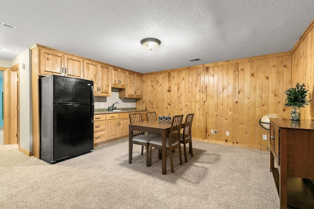 1301 Pondview Ln, Saint Joseph, MN 56374 - kitchen with freestanding refrigerator, visible vents, and light carpet