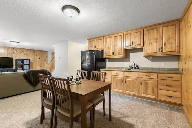 1301 Pondview Ln, Saint Joseph, MN 56374 - kitchen with freestanding refrigerator, open floor plan, wooden walls, a textured ceiling, and a sink