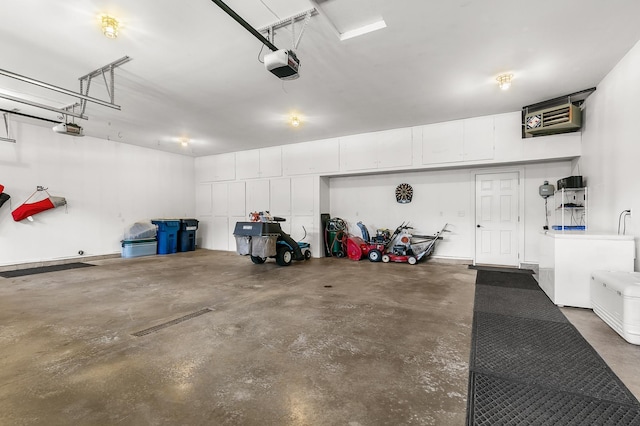 1301 Pondview Ln, Saint Joseph, MN 56374 - garage featuring a garage door opener