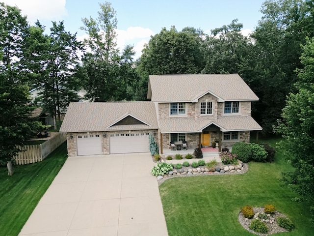 1301 Pondview Ln, Saint Joseph, MN 56374 - view of front of house with a porch, driveway, fence, an attached garage, and stone siding