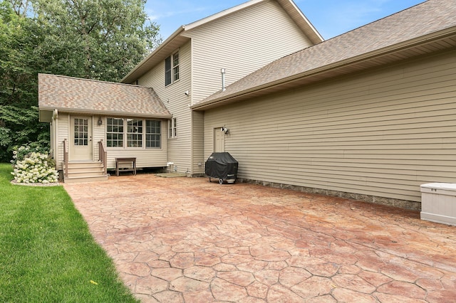 1301 Pondview Ln, Saint Joseph, MN 56374 - rear view of house featuring a patio area, roof with shingles, and entry steps