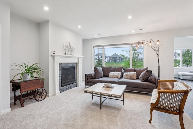 4600 Foxglove Dr, Minnetrista, MN 55331 - living area with carpet floors, healthy amount of natural light, recessed lighting, a fireplace, and baseboards