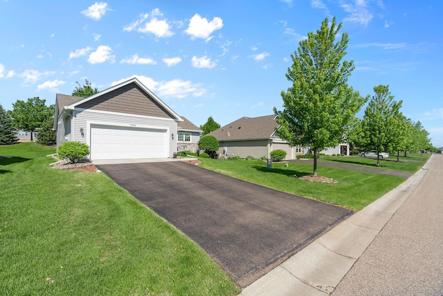 5234 Sundial Ln, Woodbury, MN 55129 - view of front of home featuring a front lawn, driveway, and a garage