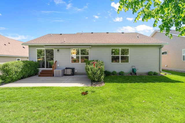 5234 Sundial Ln, Woodbury, MN 55129 - rear view of property featuring a patio area, a lawn, roof with shingles, and entry steps