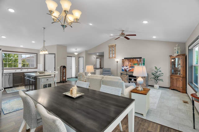 5234 Sundial Ln, Woodbury, MN 55129 - dining room with healthy amount of natural light, lofted ceiling, a chandelier, ceiling fan, and light wood-style floors