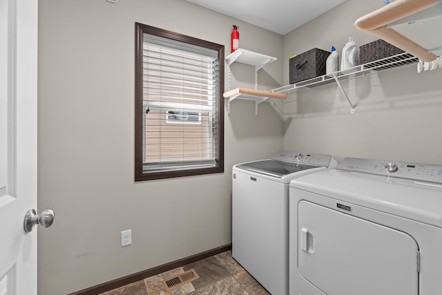 5234 Sundial Ln, Woodbury, MN 55129 - laundry area featuring washing machine and dryer and stone finish floors