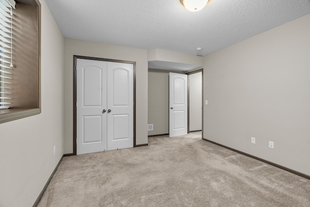 5234 Sundial Ln, Woodbury, MN 55129 - unfurnished bedroom with carpet, a closet, and a textured ceiling
