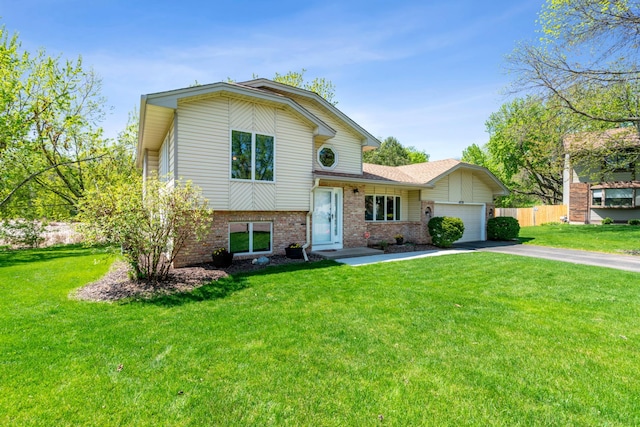 split level home featuring driveway, brick siding, and an attached garage