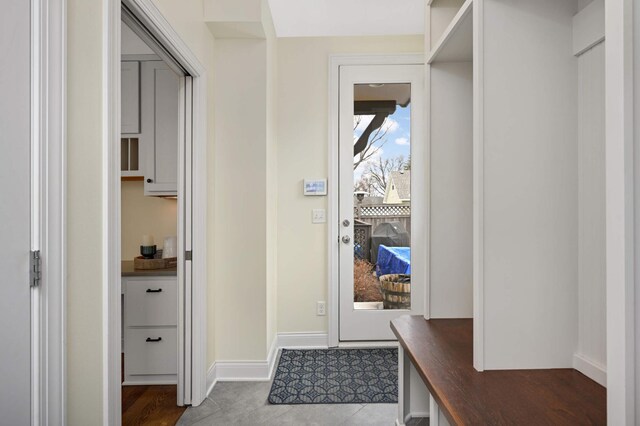 interior space featuring baseboards
