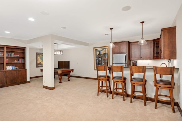 kitchen with light carpet, baseboards, billiards, and freestanding refrigerator