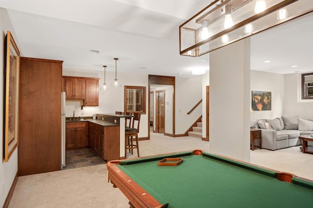recreation room with light carpet, baseboards, and pool table