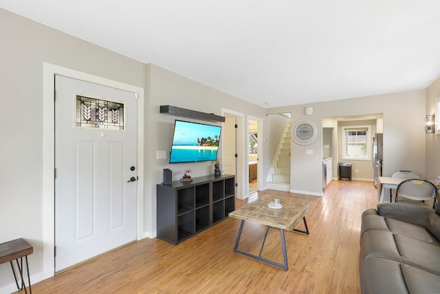 5441 44th Ave S, Minneapolis, MN 55417 - living room with stairs, light wood-style flooring, and baseboards