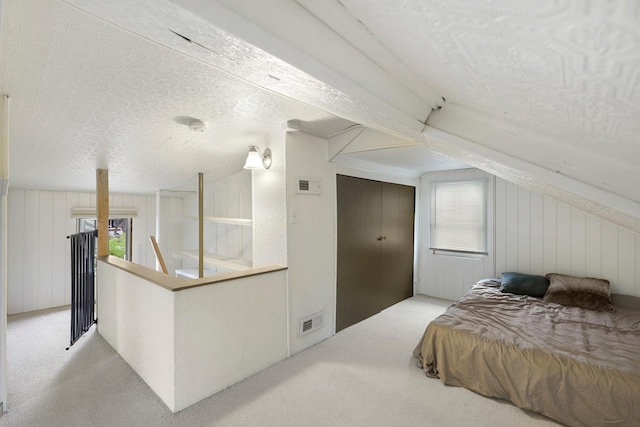 5441 44th Ave S, Minneapolis, MN 55417 - bedroom with carpet flooring, lofted ceiling, a textured ceiling, and wooden walls