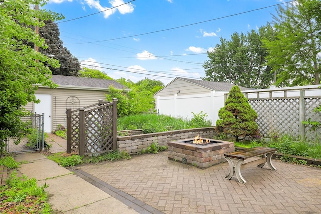 5441 44th Ave S, Minneapolis, MN 55417 - view of patio featuring an outdoor fire pit and a gate