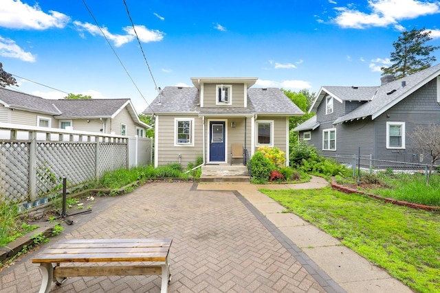 5441 44th Ave S, Minneapolis, MN 55417 - bungalow featuring a patio and a shingled roof
