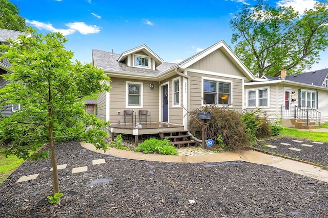 5441 44th Ave S, Minneapolis, MN 55417 - view of front of home featuring a deck and roof with shingles