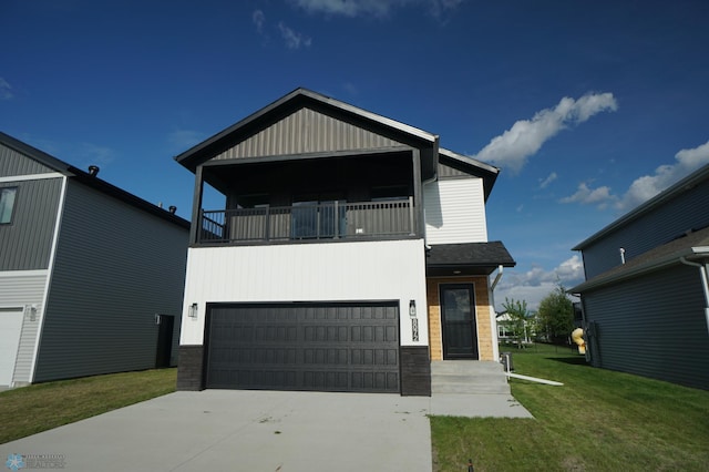 8072 Goldfinch Dr, Horace, ND 58047 - modern home featuring a balcony, an attached garage, a front yard, driveway, and board and batten siding