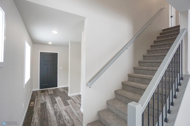 8072 Goldfinch Dr, Horace, ND 58047 - entryway with wood finished floors, stairway, baseboards, and recessed lighting