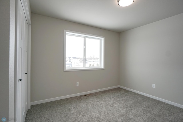 8072 Goldfinch Dr, Horace, ND 58047 - unfurnished bedroom featuring carpet floors, baseboards, and a closet