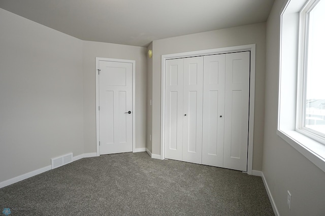 8072 Goldfinch Dr, Horace, ND 58047 - unfurnished bedroom featuring carpet floors, baseboards, and a closet