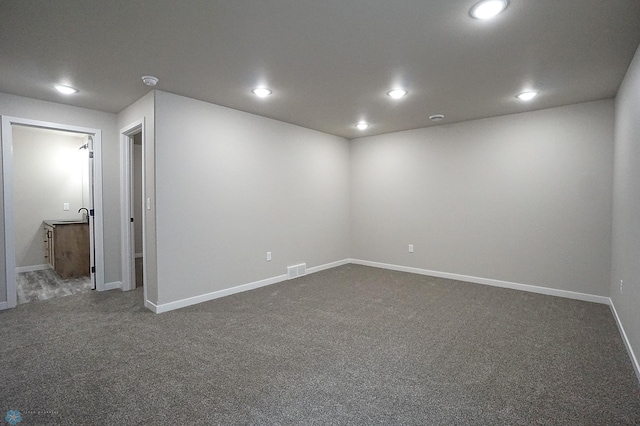 8072 Goldfinch Dr, Horace, ND 58047 - spare room featuring dark carpet, baseboards, and recessed lighting