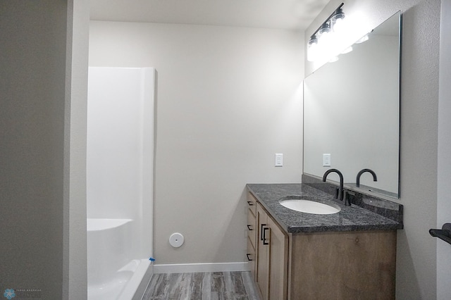 8072 Goldfinch Dr, Horace, ND 58047 - bathroom with wood finished floors, vanity, and baseboards