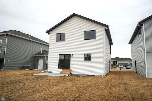 8072 Goldfinch Dr, Horace, ND 58047 - rear view of house with entry steps, a yard, and central AC unit