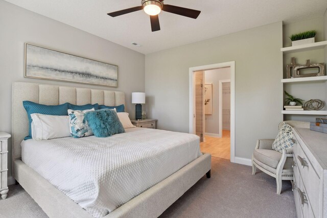 3725 Queensland Ln N, Plymouth, MN 55446 - bedroom featuring connected bathroom, baseboards, visible vents, ceiling fan, and carpet