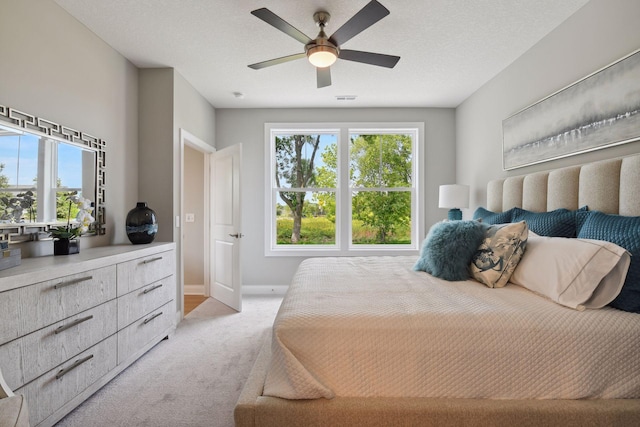3725 Queensland Ln N, Plymouth, MN 55446 - bedroom with light carpet, multiple windows, ceiling fan, and visible vents