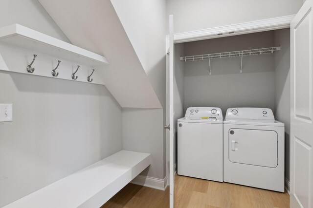 3725 Queensland Ln N, Plymouth, MN 55446 - washroom featuring light wood finished floors, washer and dryer, and laundry area