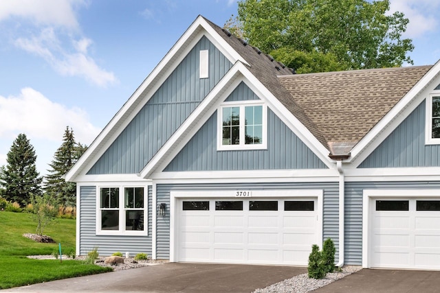 3725 Queensland Ln N, Plymouth, MN 55446 - garage with aphalt driveway