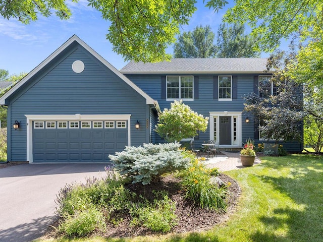 8118 Currant Pl, Eden Prairie, MN 55347 - colonial house featuring a front yard, driveway, and a garage