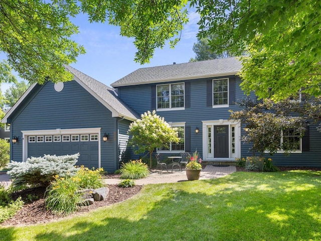 8118 Currant Pl, Eden Prairie, MN 55347 - colonial-style house featuring an attached garage, a front yard, and a shingled roof