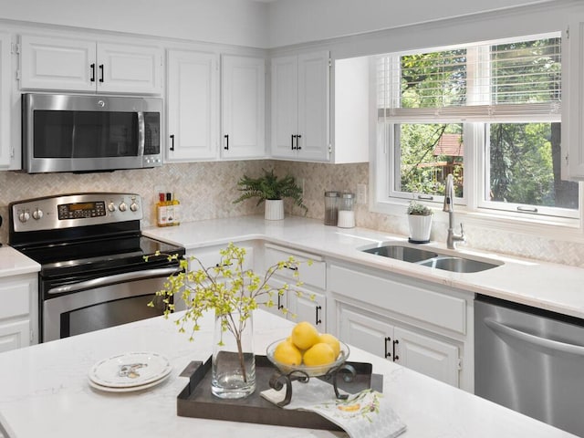 8118 Currant Pl, Eden Prairie, MN 55347 - kitchen with stainless steel appliances, light countertops, and white cabinetry